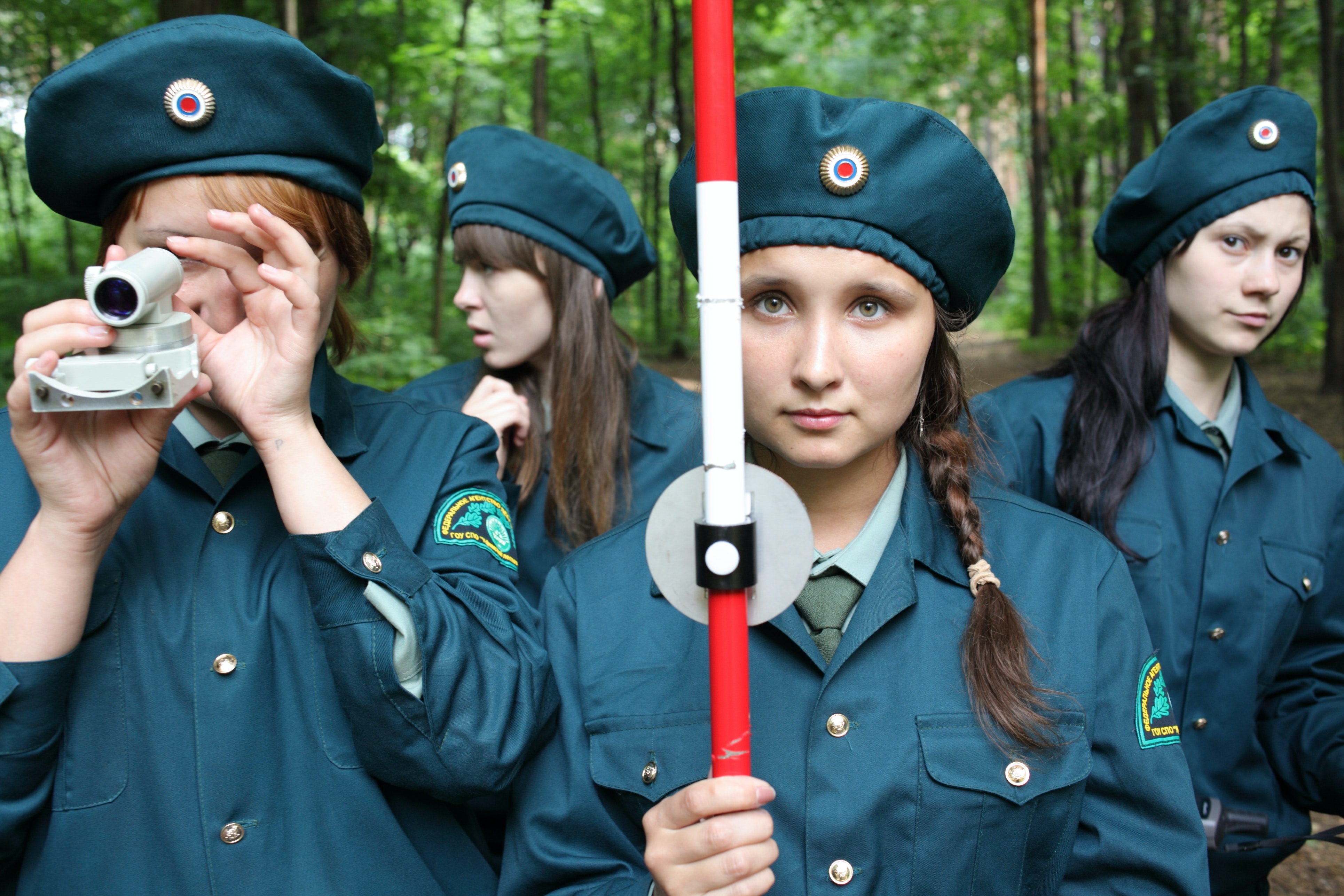 four girl scouts in uniform